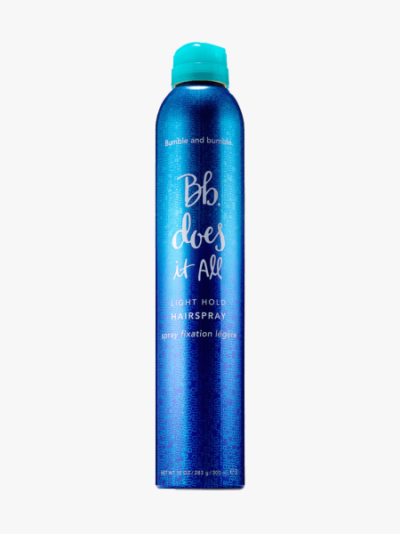 Bumble and Bumble Does It All Light Hold Hairspray in blue bottle with blue spray pump on light gray background
